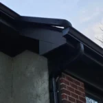 Black gutter corner and elbow detail on Dayton Ohio home showing clean installation and fit