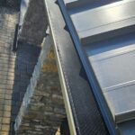 Gutter guard installation on metal roof in Indian Hill Ohio showing debris protection system