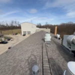 Steep slope roof replacement completed by TruCraft Roofing in Cincinnati Ohio showing roof ridge and mechanical units