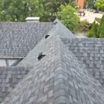 Asphalt shingle roof replacement in Hyde Park Ohio showing ridge line and roof ventilation