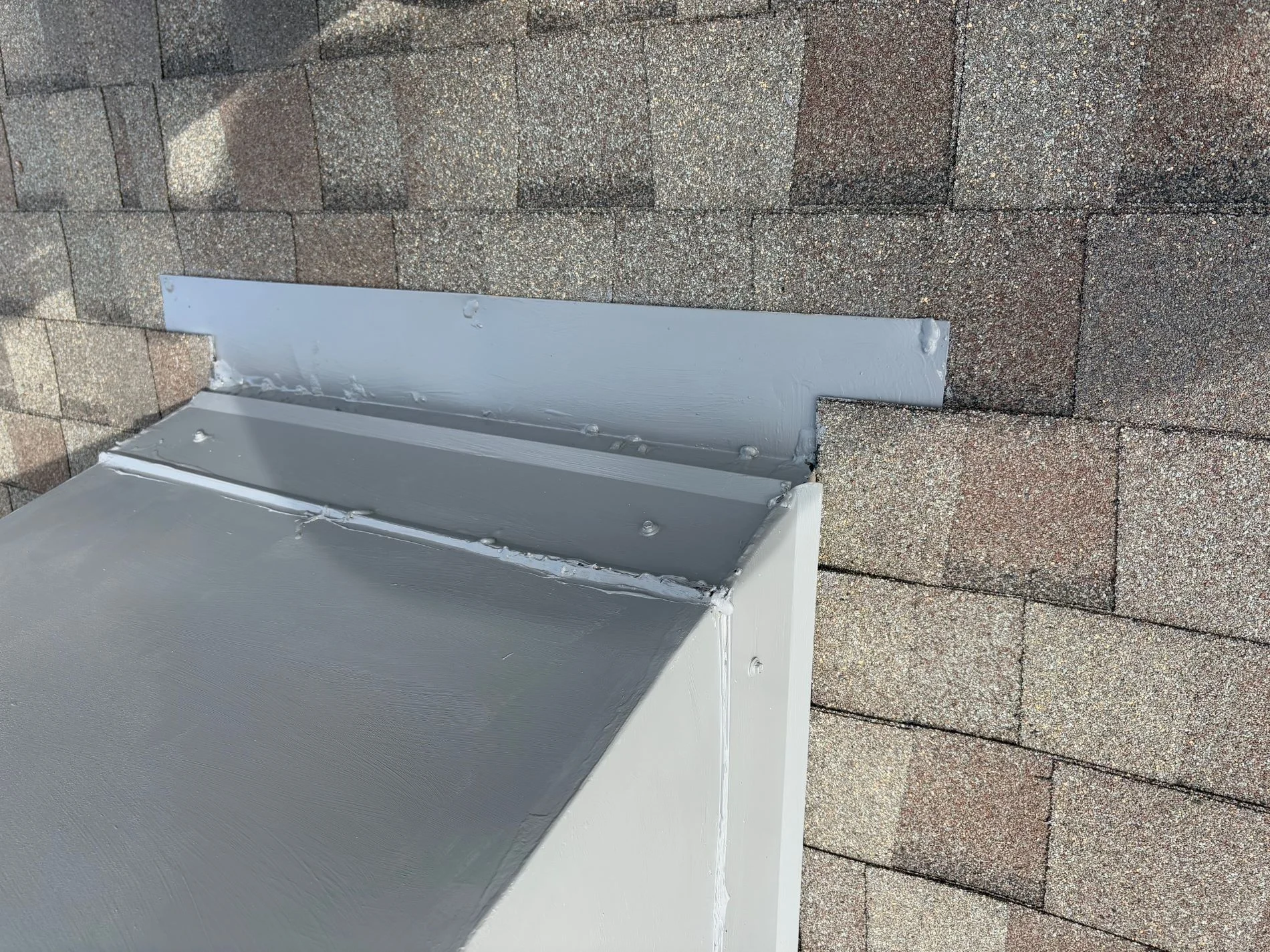 Roof flashing detail installation on asphalt shingle roof