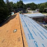 Installing CertainTeed RoofRunner synthetic underlayment during a roof replacement in Mason, OH
