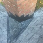 New chimney cricket and flashing installed during a Maineville, Ohio roof repair.